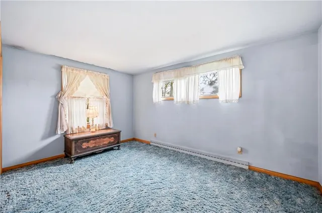 a bathroom with a sink a mirror and shower