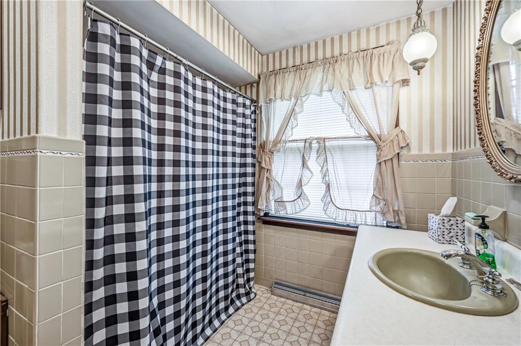 520 South Maysville Road Greenville, PA 16125 - Photo 22 of 33 a bathroom with a sink a mirror and shower