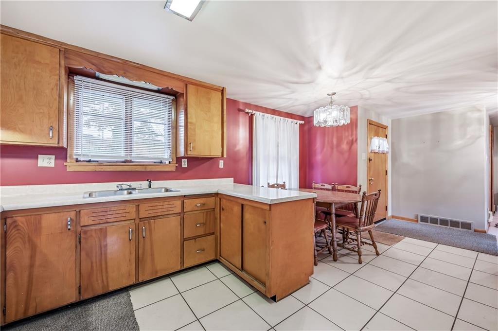 520 South Maysville Road Greenville, PA 16125 - Photo 5 of 33 a kitchen with a sink and chairs
