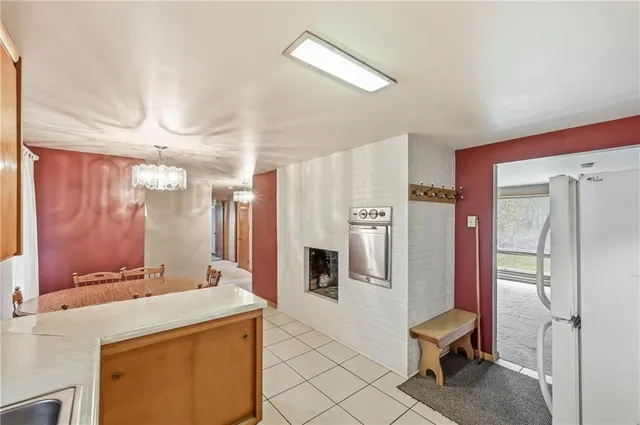 a bathroom with a granite countertop sink a mirror and a shower