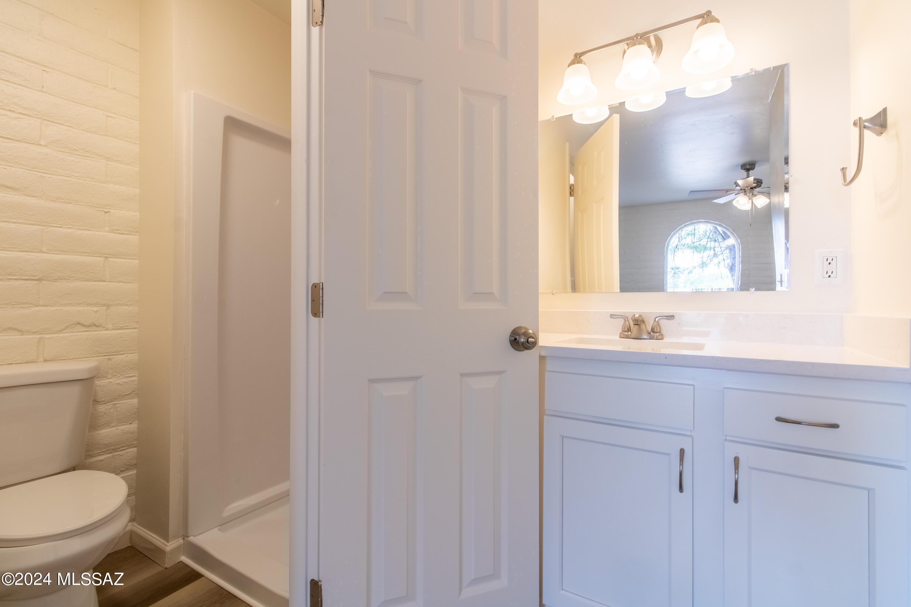 1846 West Dominy Road Tucson, AZ 85713 - Photo 11 of 17 a bathroom with a toilet a sink and mirror