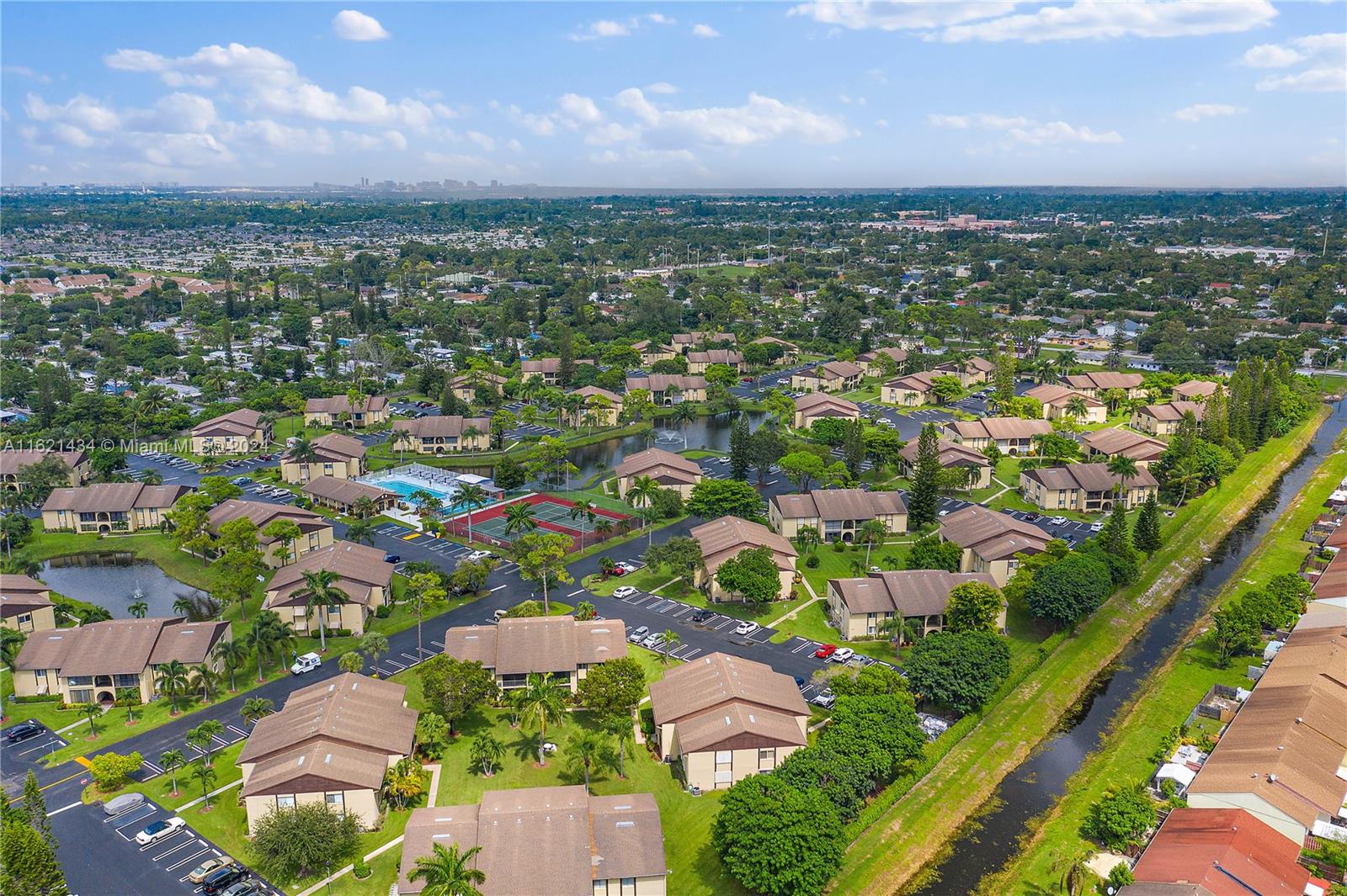 341 Pine Ridge Circle, Unit B2 Greenacres, FL 33463 - Photo 43 of 49 an aerial view of residential houses with outdoor space