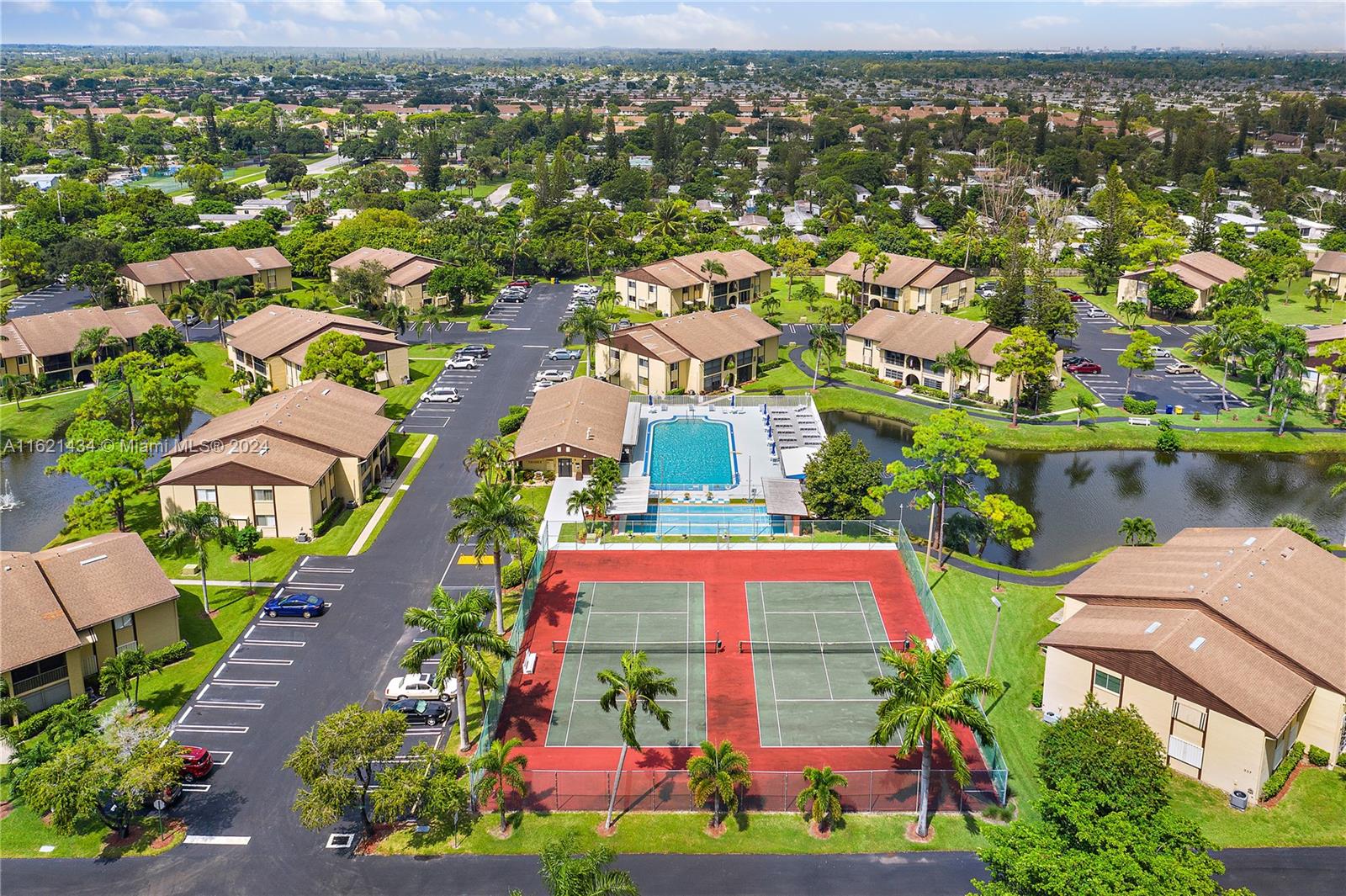 341 Pine Ridge Circle, Unit B2 Greenacres, FL 33463 - Photo 46 of 49 an aerial view of residential houses with outdoor space and street view