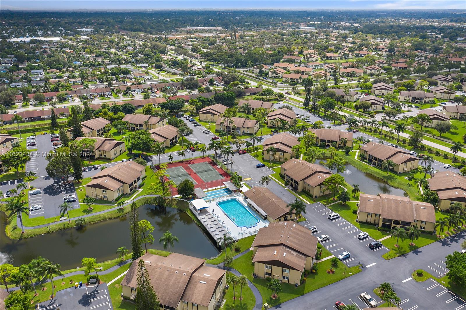 341 Pine Ridge Circle, Unit B2 Greenacres, FL 33463 - Photo 49 of 49 an aerial view of residential houses with outdoor space