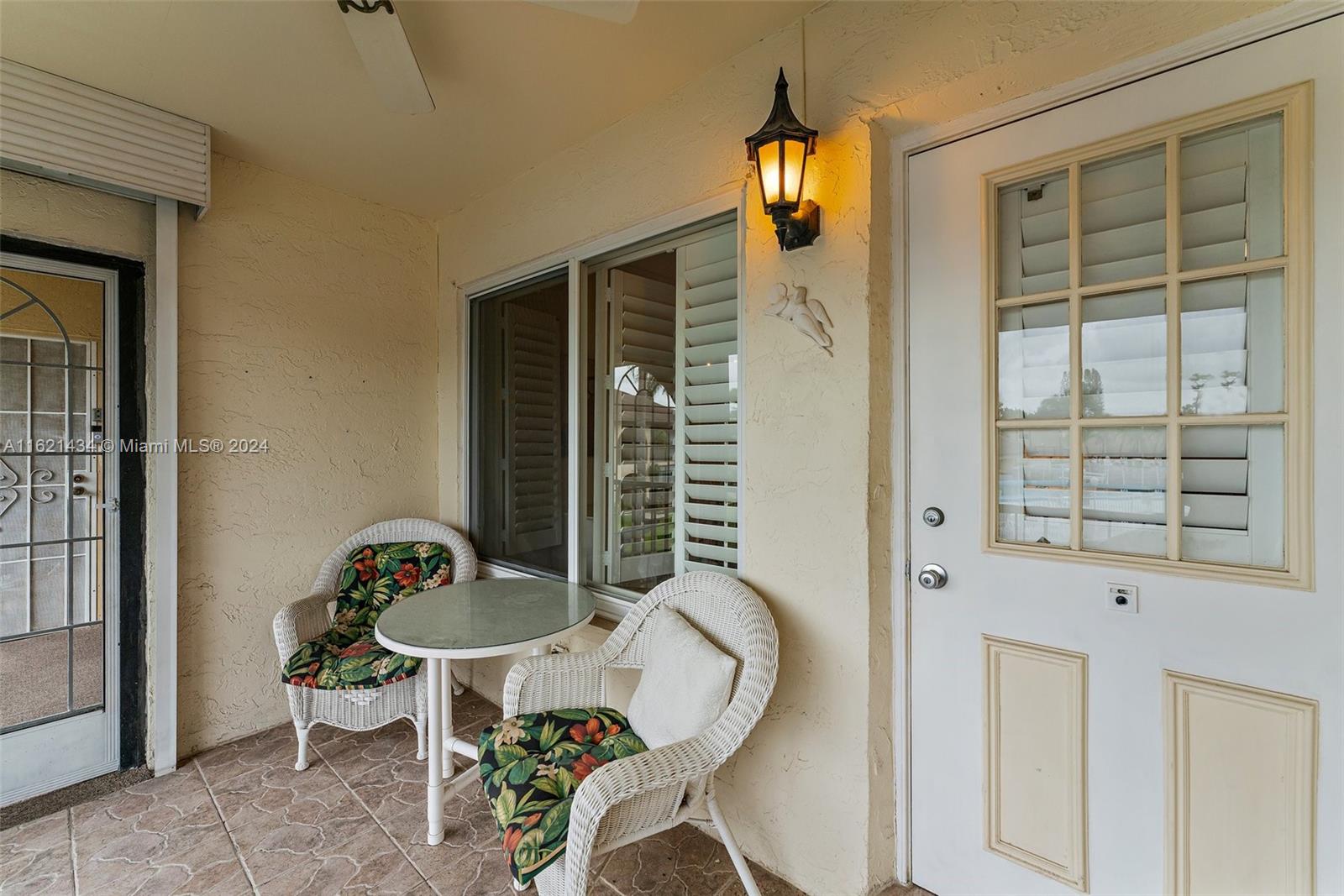 341 Pine Ridge Circle, Unit B2 Greenacres, FL 33463 - Photo 9 of 49 a front view of a house with outdoor seating
