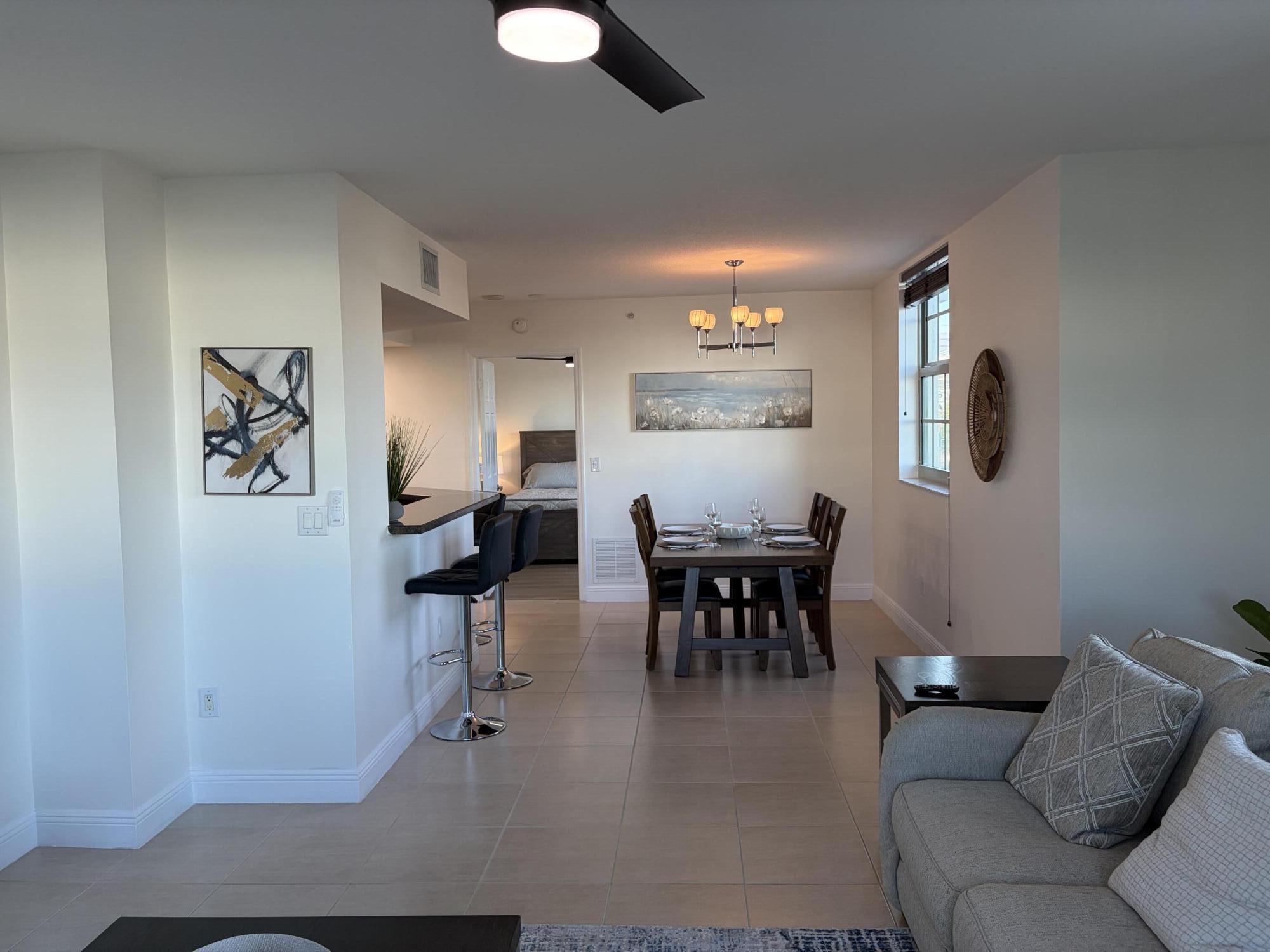 610 Clematis Street West Palm Beach, FL 33401 - Photo 11 of 33 a living room with furniture and a dining room