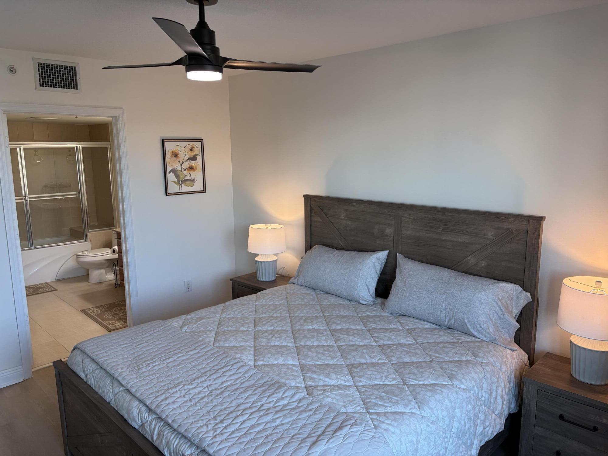 610 Clematis Street West Palm Beach, FL 33401 - Photo 12 of 33 a bedroom with a bed and wooden floor