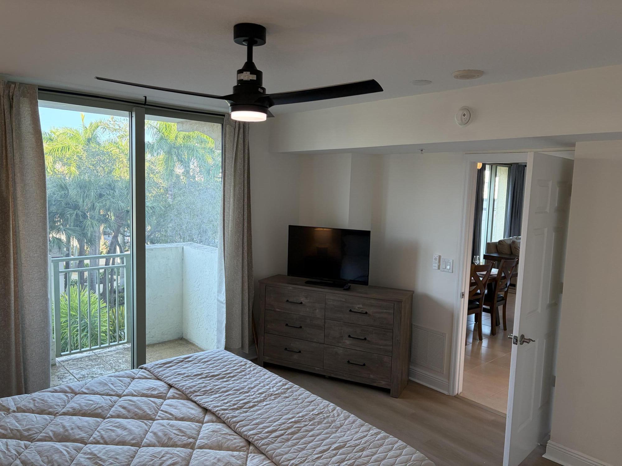 610 Clematis Street West Palm Beach, FL 33401 - Photo 13 of 33 a room with furniture and a flat screen tv