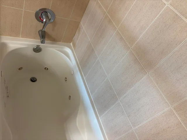 a bathroom with a sink vanity and a mirror