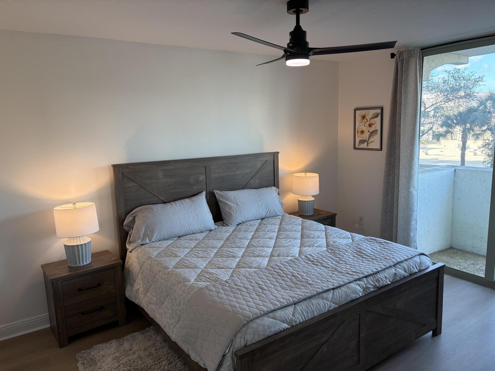 610 Clematis Street West Palm Beach, FL 33401 - Photo 18 of 33 a bedroom with a bed and window