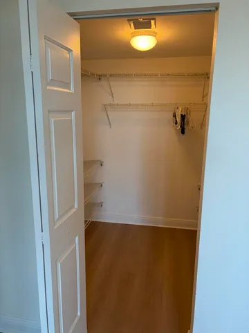 a bathroom with a shower and a mirror