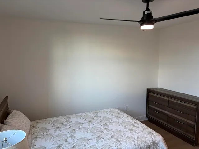 an empty room with wooden floor