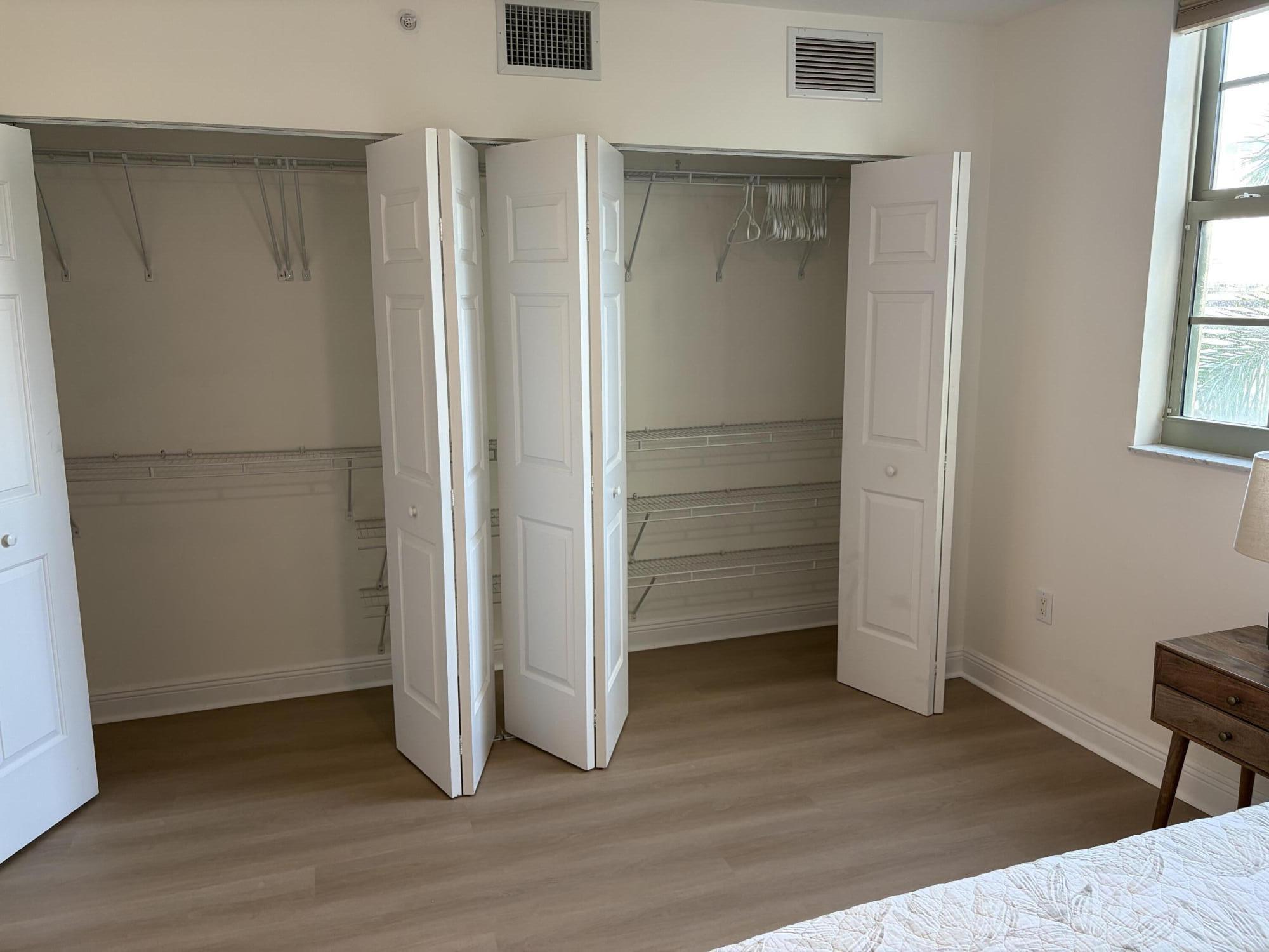 610 Clematis Street West Palm Beach, FL 33401 - Photo 27 of 33 a view of walk in closet with empty racks