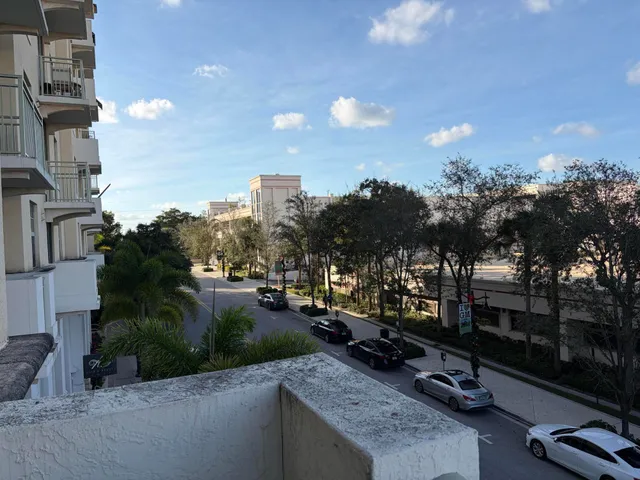 a view of a balcony with chairs