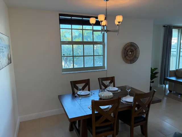 a view of a dining room that has a table and chairs