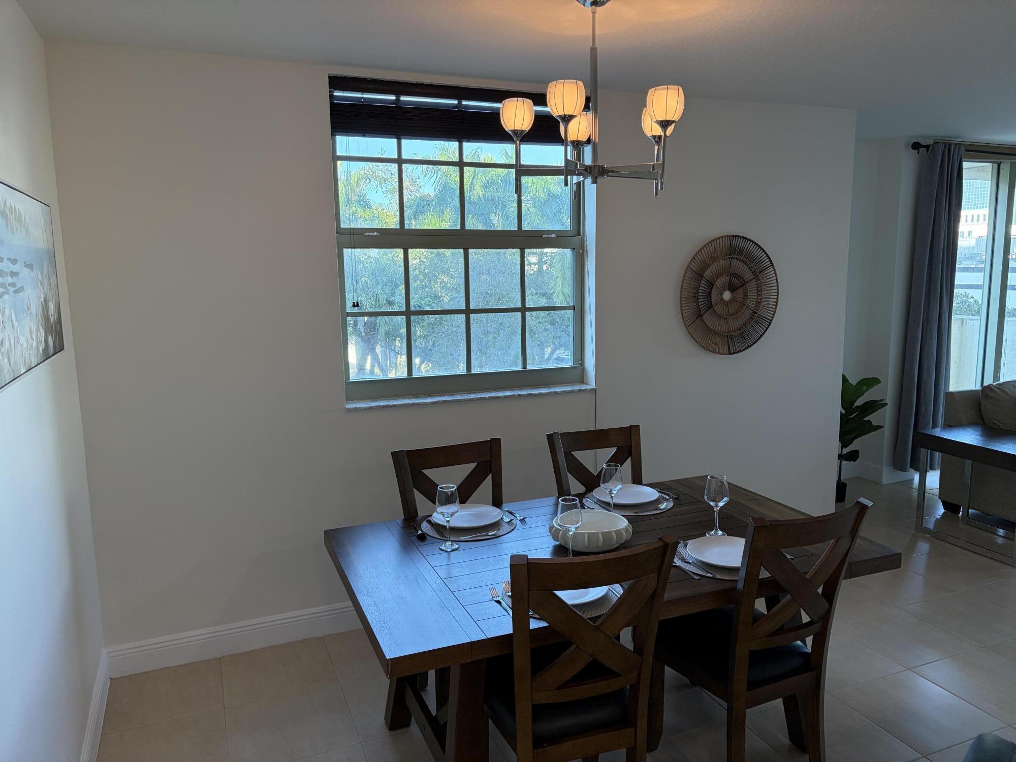 610 Clematis Street West Palm Beach, FL 33401 - Photo 5 of 33 a view of a dining room that has a table and chairs