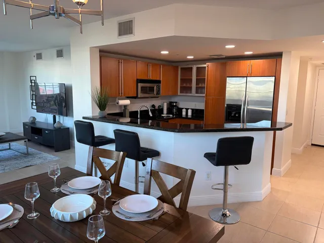 a kitchen with a table and chairs in it