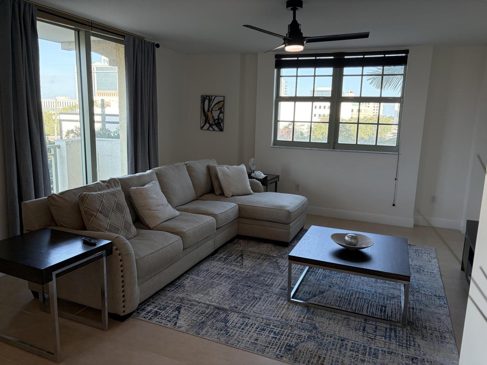 610 Clematis Street West Palm Beach, FL 33401 - Photo 7 of 33 a living room with furniture and a window