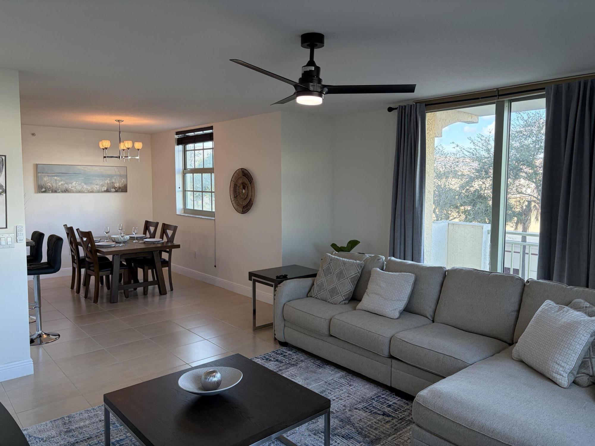 610 Clematis Street West Palm Beach, FL 33401 - Photo 9 of 33 a living room with furniture and a large window