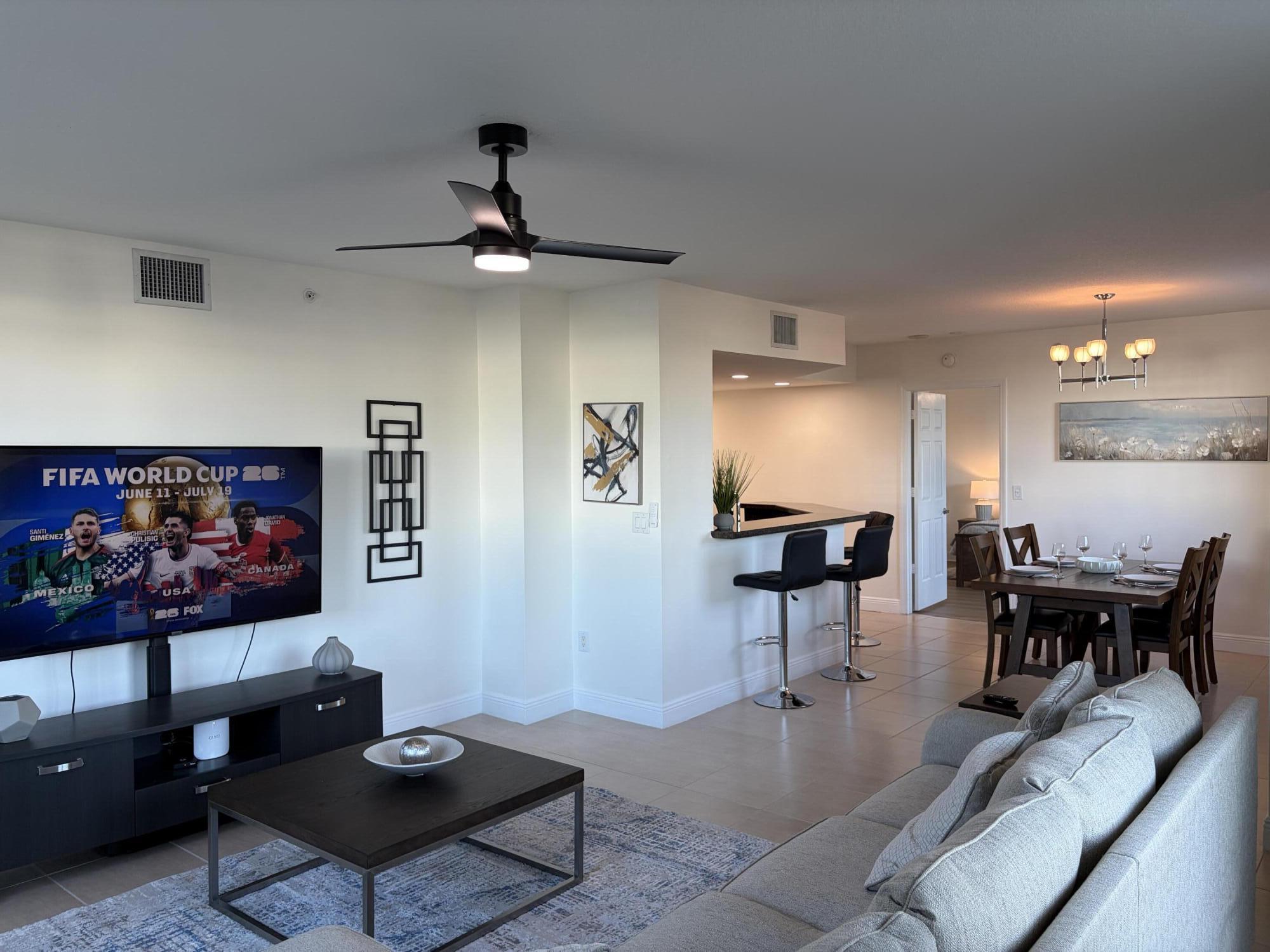 610 Clematis Street West Palm Beach, FL 33401 - Photo 10 of 33 a living room with furniture and a flat screen tv