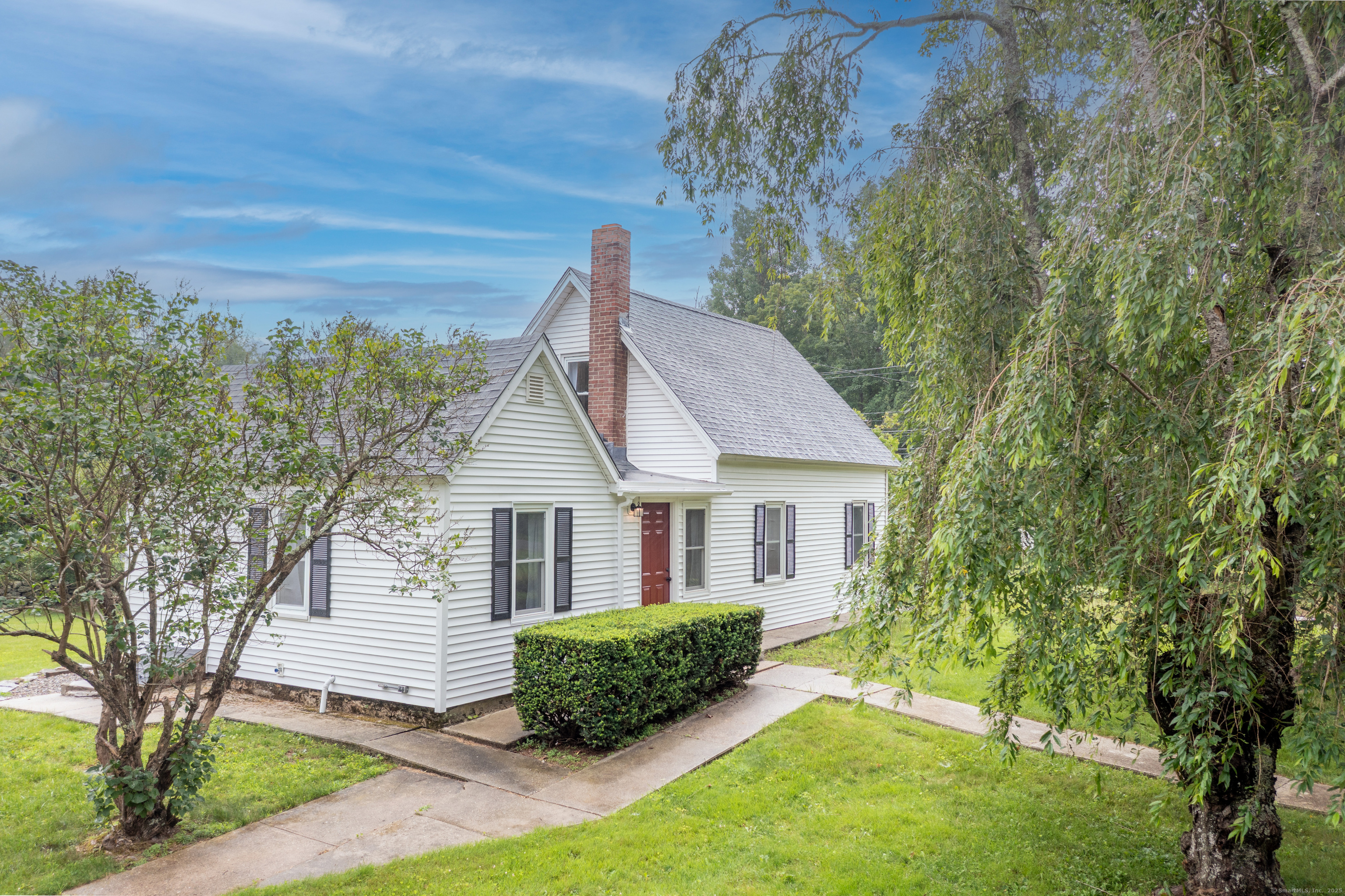 a front view of a house with a yard