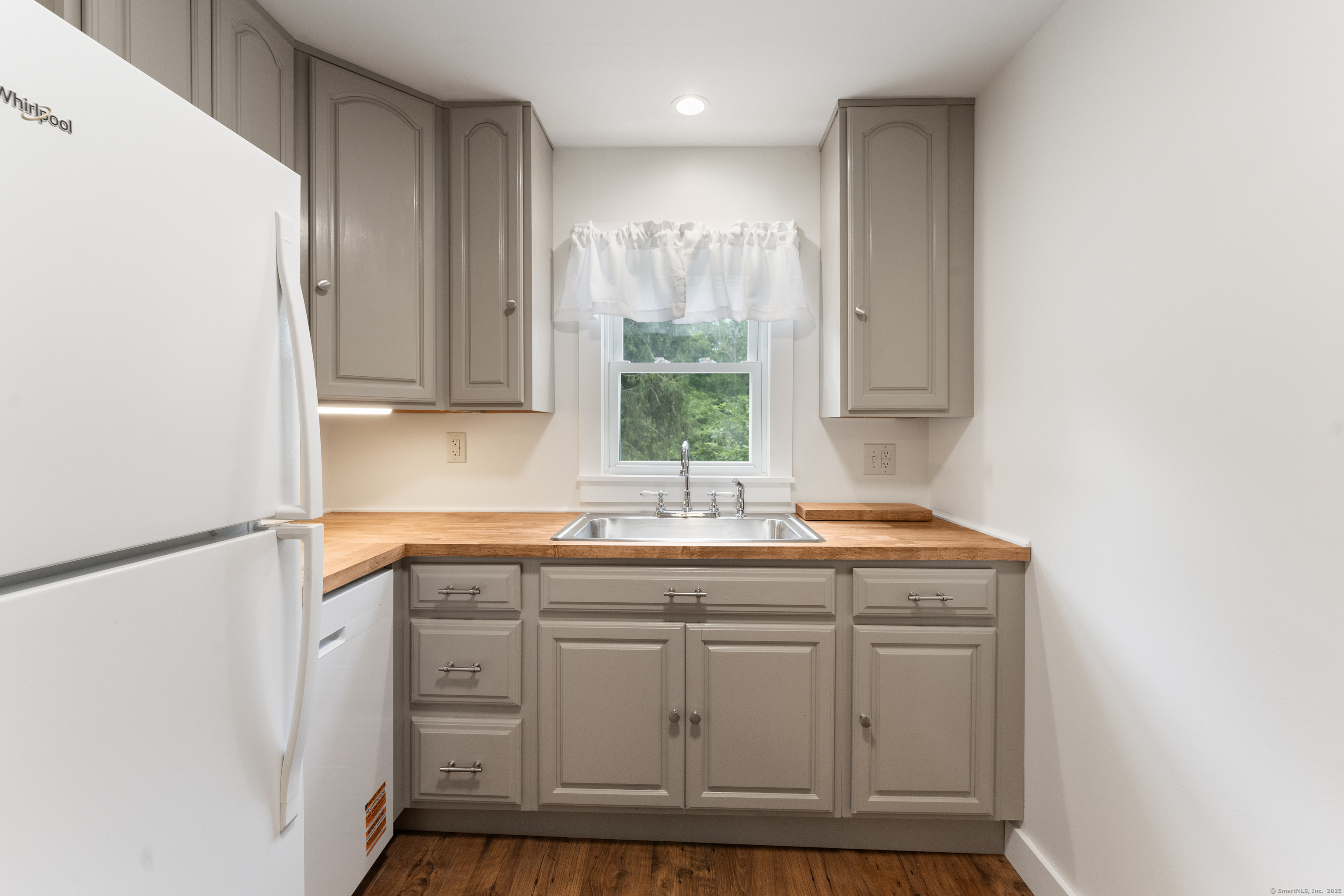 361 Westminster Road Canterbury, CT 06331 - Photo 11 of 38 a kitchen with stainless steel appliances granite countertop a sink and a refrigerator