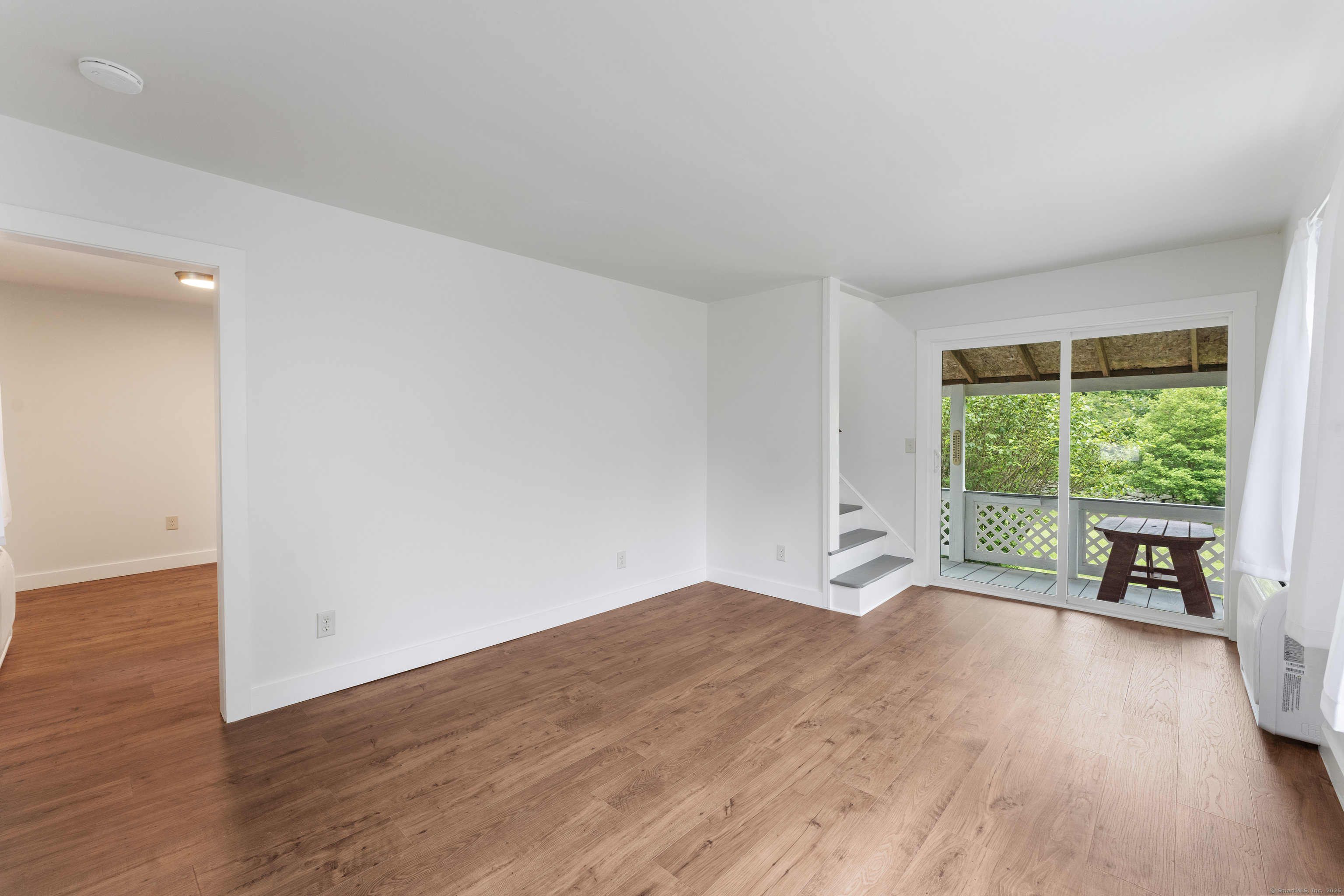 361 Westminster Road Canterbury, CT 06331 - Photo 12 of 38 a view of a room with wooden floor and a large window
