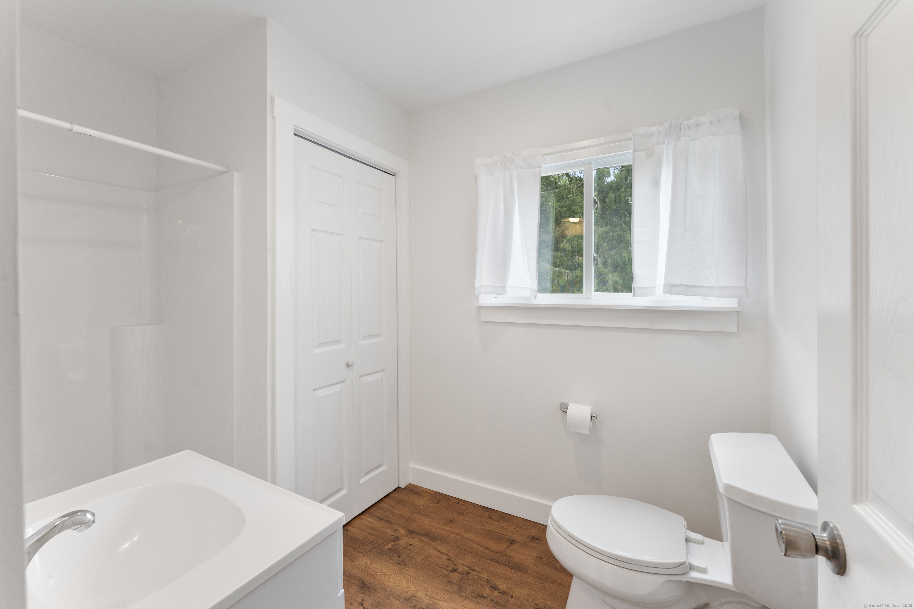 361 Westminster Road Canterbury, CT 06331 - Photo 19 of 38 a white toilet sitting next to a bathroom sink