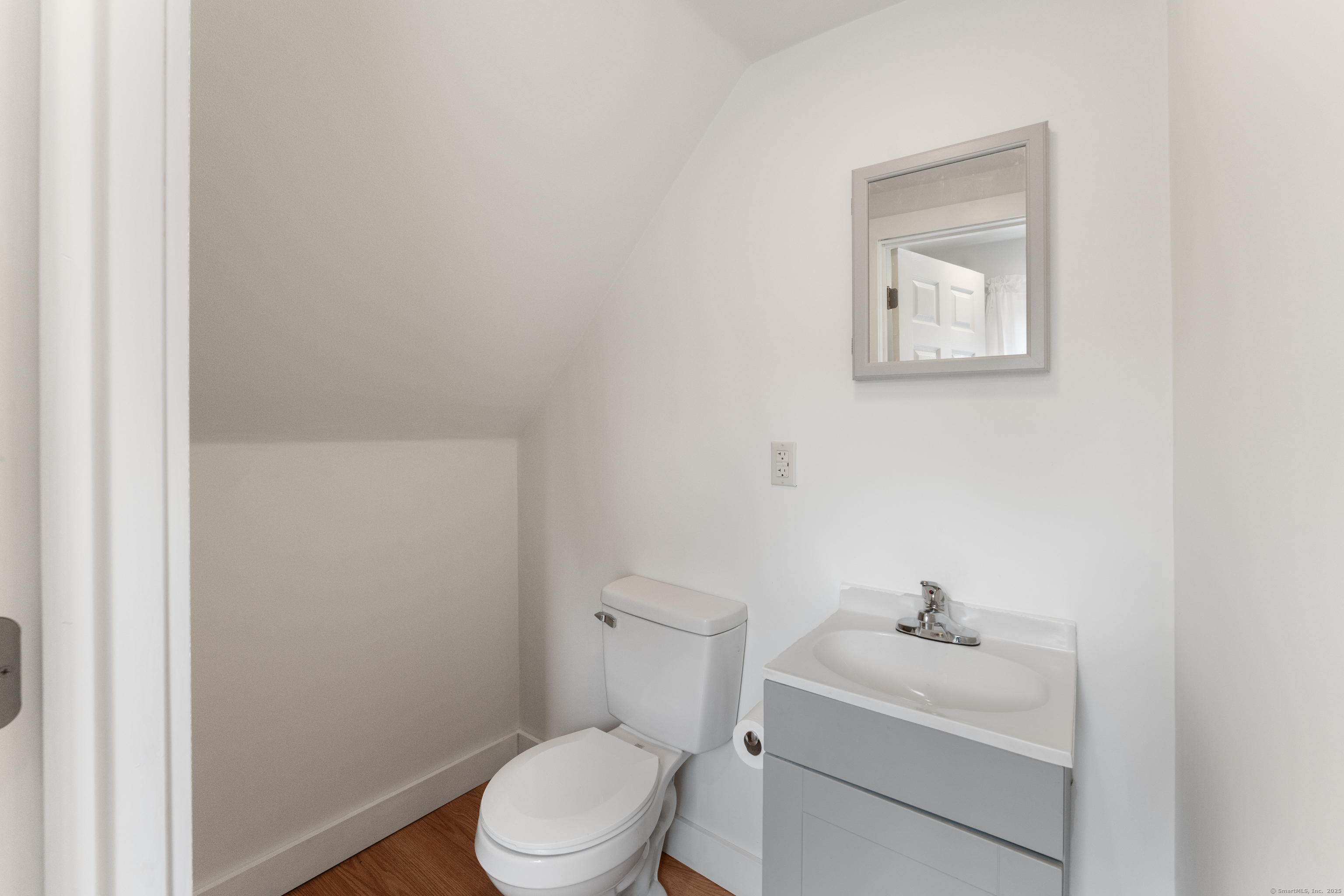 361 Westminster Road Canterbury, CT 06331 - Photo 23 of 38 a bathroom with a toilet a sink and mirror