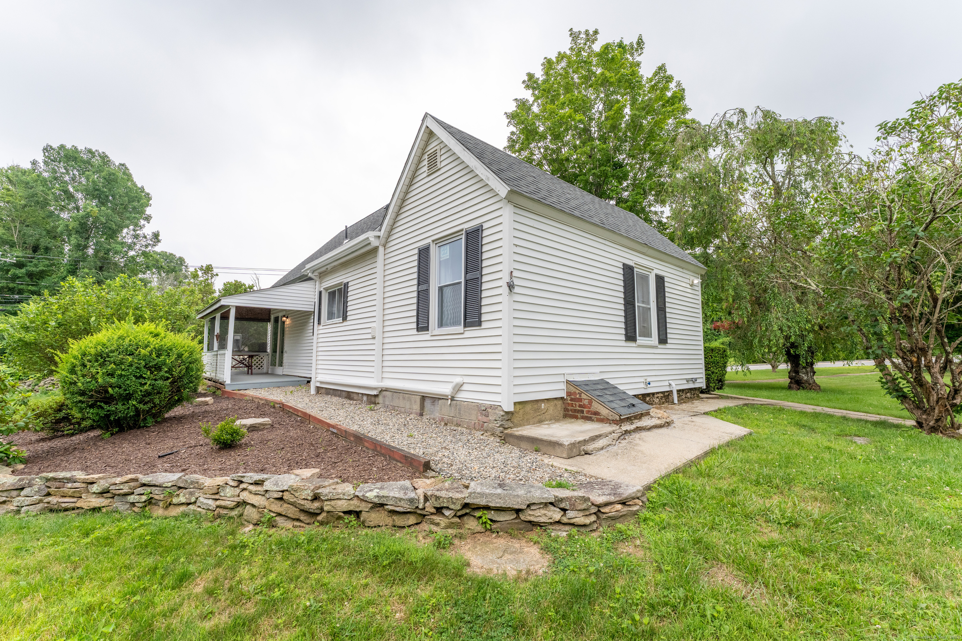 361 Westminster Road Canterbury, CT 06331 - Photo 5 of 38 a backyard of a house with table and chairs