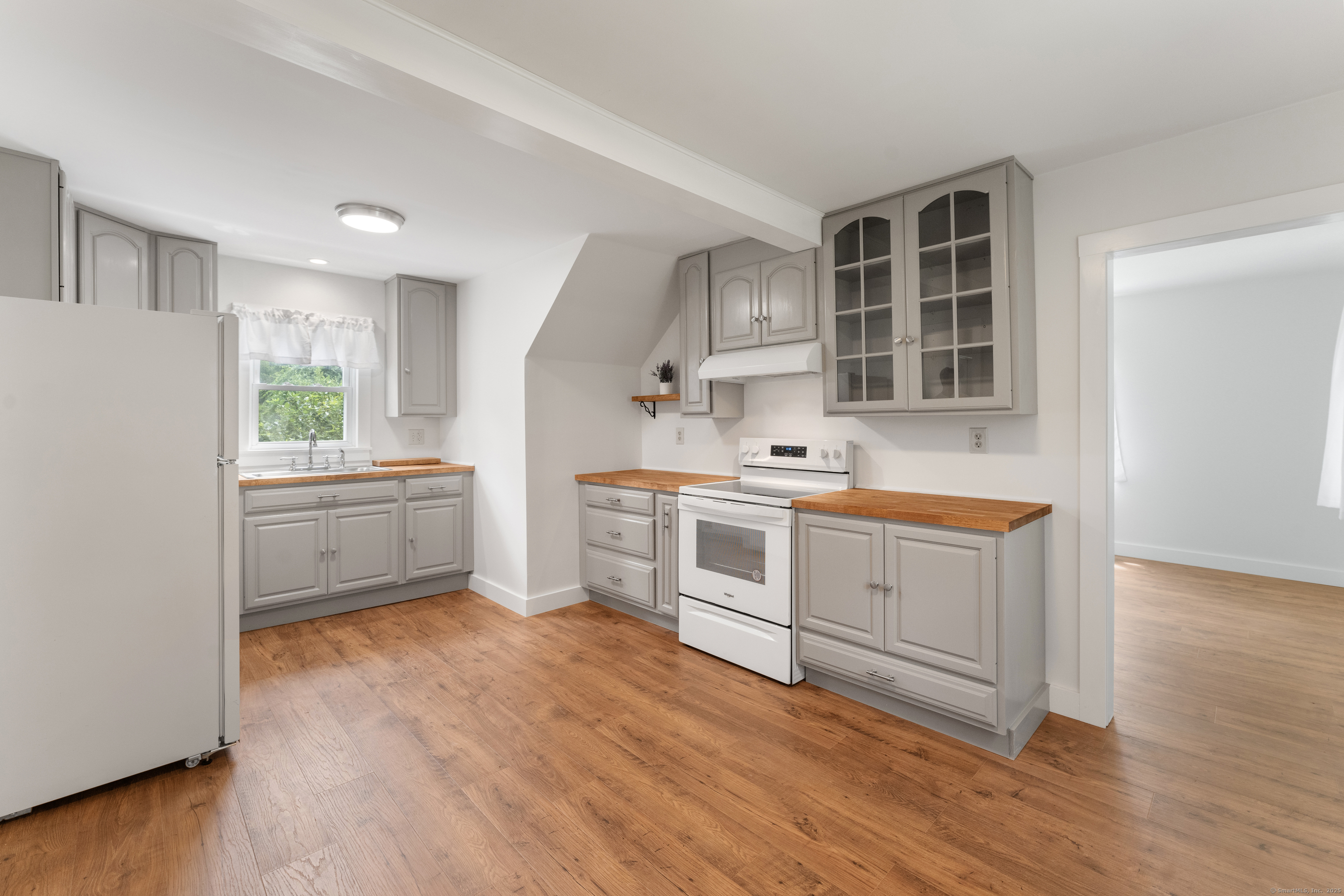 361 Westminster Road Canterbury, CT 06331 - Photo 7 of 38 a kitchen with white cabinets and white appliances