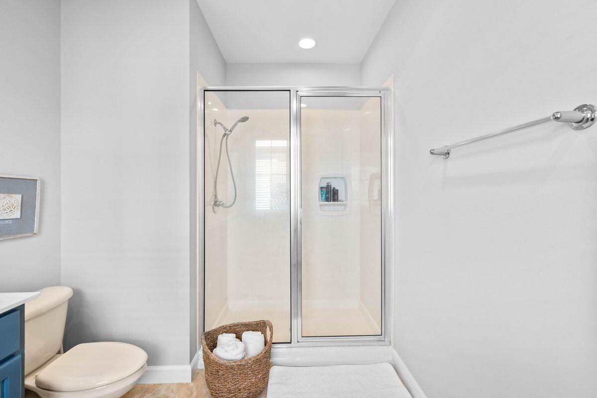 133 South Zander Way Santa Rosa Beach, FL 32459 - Photo 23 of 33 a bathroom with a granite countertop toilet and a shower