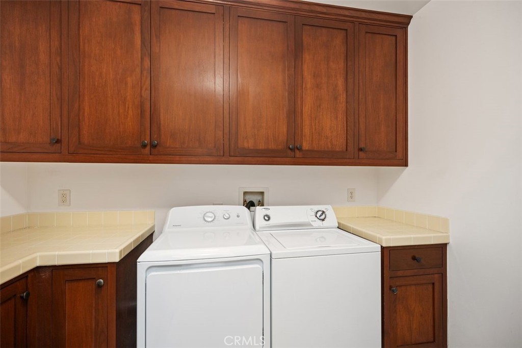 240 Avenida Rosa, Unit B San Clemente, CA 92672 - Photo 26 of 31 Laundry room with washer and dryer.