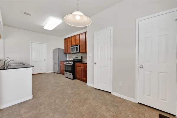 a view of a kitchen with a sink and dishwasher kitchen view