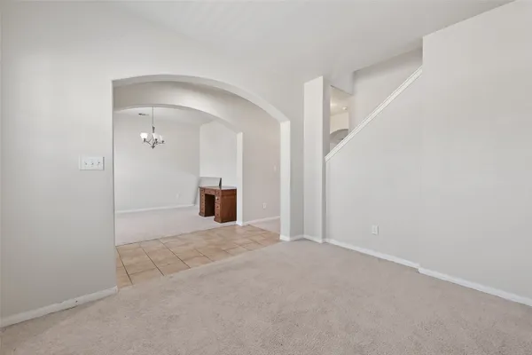 a view of a big room with closet and windows