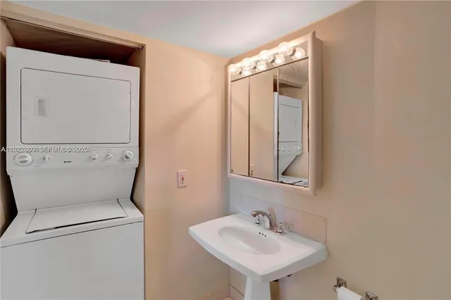 a view of a room with wooden floor and bench