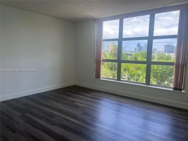 a view of a city with tall buildings