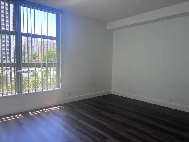 a view of a building with a yard