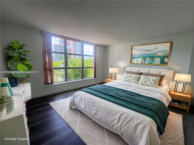 a bedroom with bed and a window