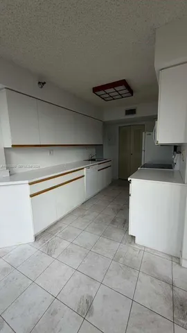 a bathroom with a sink toilet and mirror