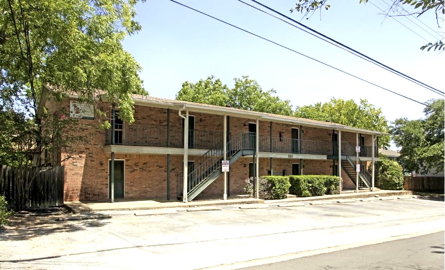 630 Maiden Lane, Unit H Austin, TX 78705 - Photo 1 of 1 Two-story brick building with multiple entry doors and wrought iron balconies