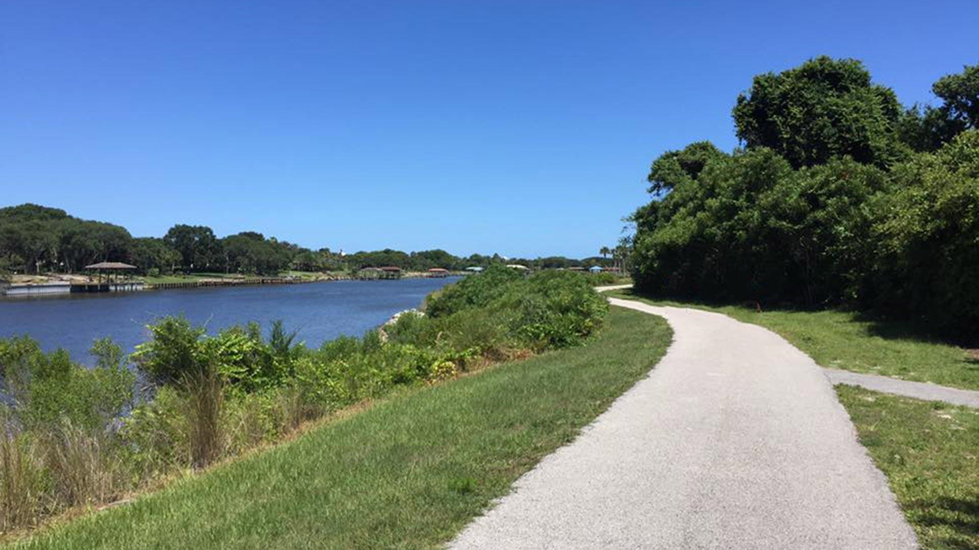 237 Redbud Road Palm Coast, FL 32137 - Photo 30 of 33 a view of a lake with a yard
