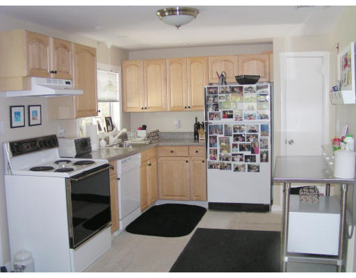53 Richard Road Needham, MA 02492 - Photo 2 of 4 a kitchen with a stove and a sink