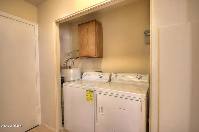 a utility room with dryer and washer
