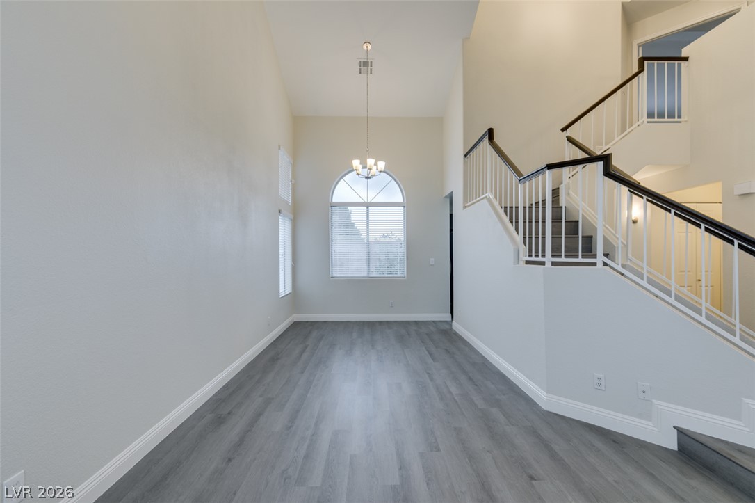 1738 Toltec Circle Henderson, NV 89014 - Photo 44 of 46 A grand entrance with high ceilings and a striking staircase welcomes you home.