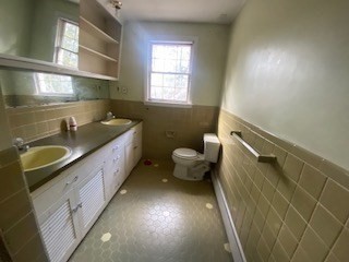 118 Kendall Road Lexington, MA 02421 - Photo 20 of 33 a bathroom with a granite countertop sink a toilet and a mirror