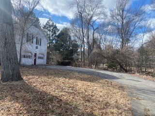118 Kendall Road Lexington, MA 02421 - Photo 3 of 33 a view of a road with a white house