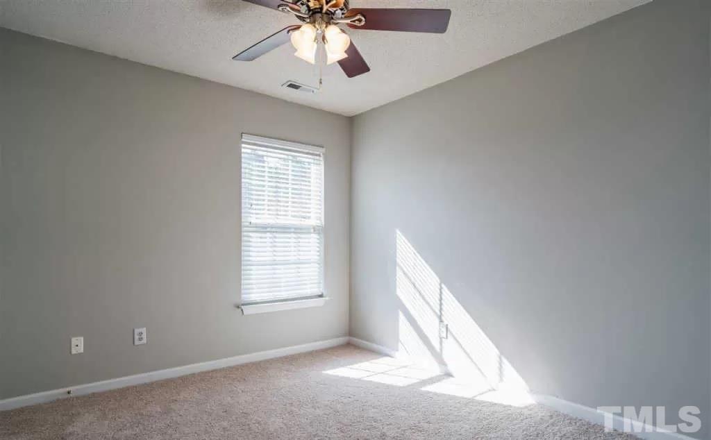 302 Durston Loop Morrisville, NC 27560 - Photo 4 of 4 a view of an empty room with a window