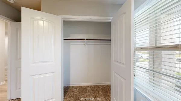 a view of walk in closet with window