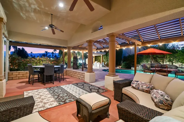 a view of a living room and a floor to ceiling window